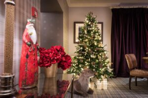 Christmas tree and decorations in the Tartan Lounge at Derwentwater House – luxury Lake District Christmas accommodation.