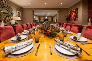 Festively set Christmas dining table at Derwentwater House in Keswick – ideal for group celebrations in the Lake District.
