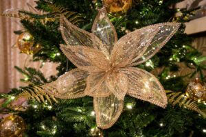 Close-up of golden Christmas tree ornament in the Quiet Lounge at Derwentwater House – festive details for a Christmas break in the Lakes.